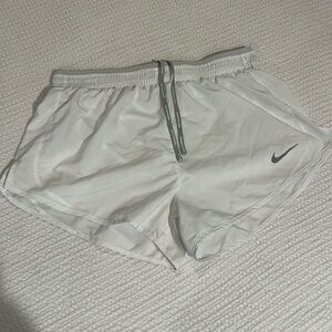 White Nike running shorts